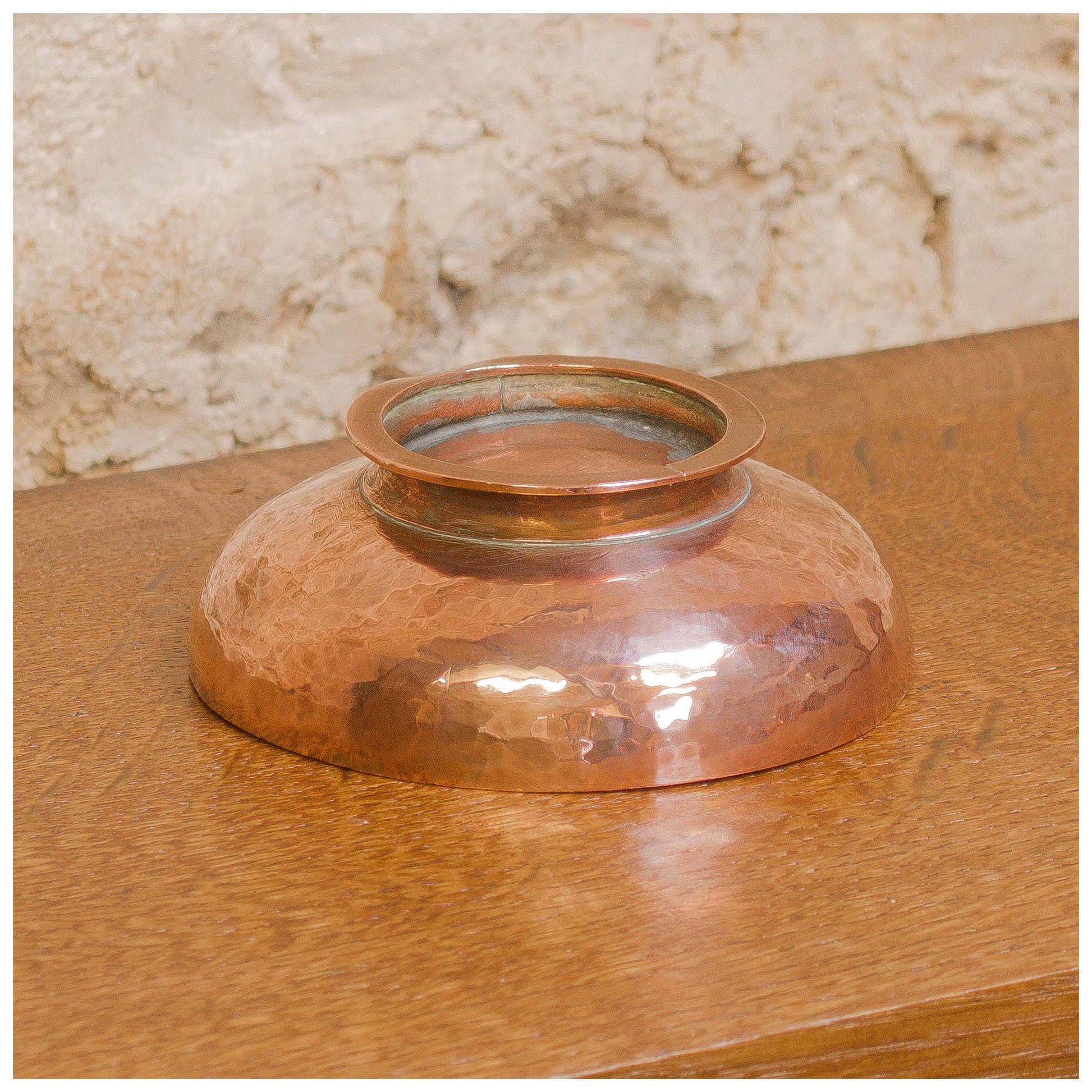 An Arts & Crafts Lakes School hand beaten copper bowl by Fanny Carter