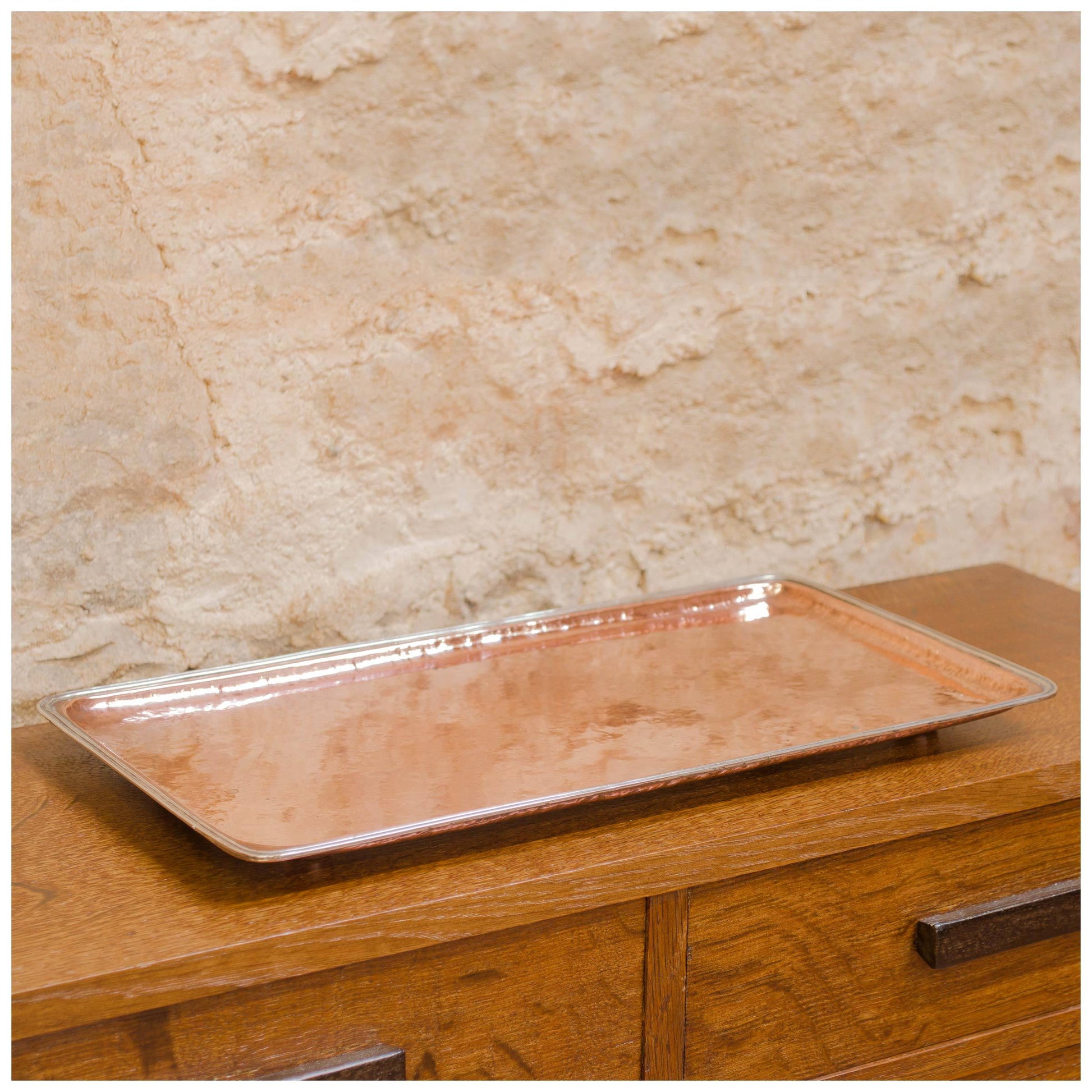 An Arts & Crafts Lakes School hand beaten copper tray by Fanny Carter